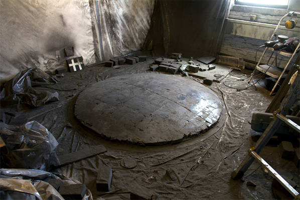 Alejandra Prieto, Studio view with Convex Coal Mirror (coal, 72 x 72 x 8 inches) on floor
