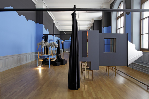 Yves Netzhammer, Das Reservat der Nachteile, 2010<br/>Mixed media installation: movable curtains, objects, film and music<br/>Installation view Kunstmuseum Bern (solo exhibition)/ CH, 2010 <br/>